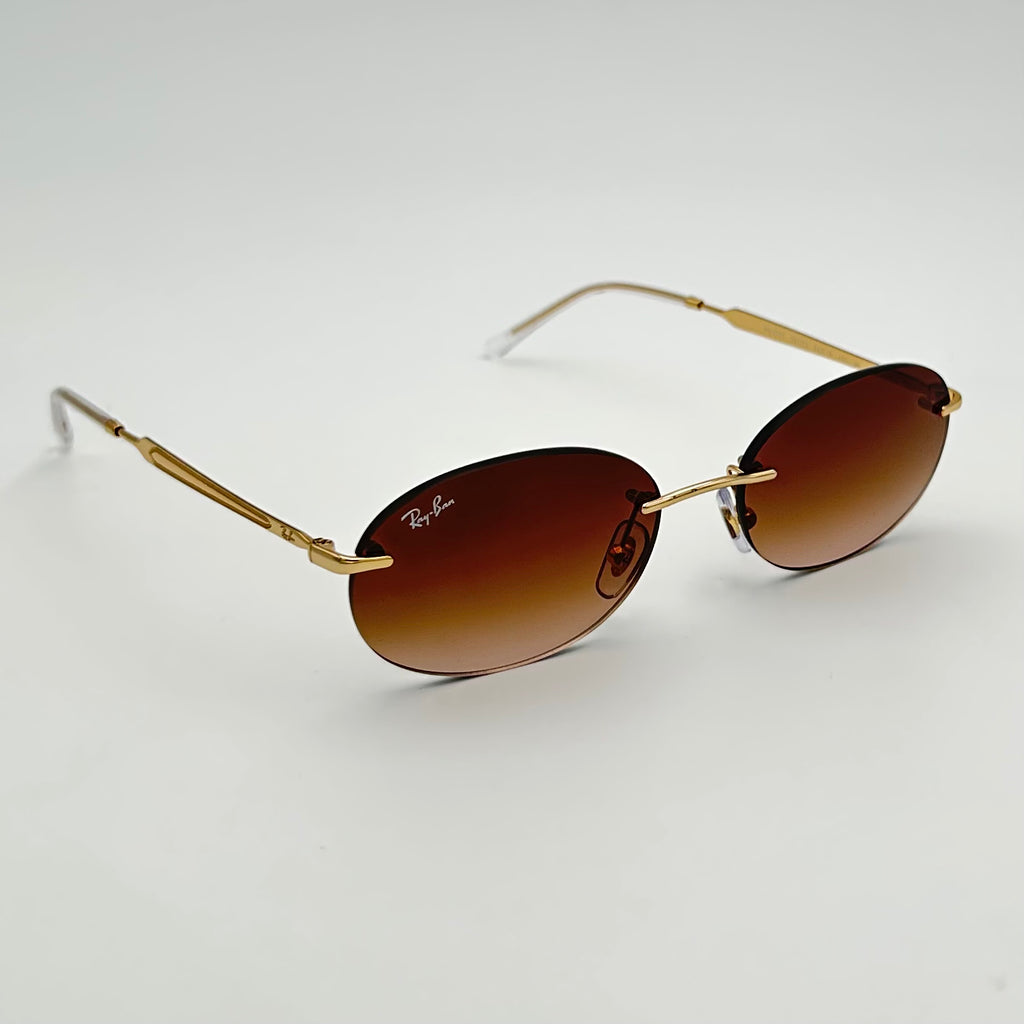 Ray-Ban RB3767 vues de trois quarts, monture fine dorée Arista et verres marron dégradés
